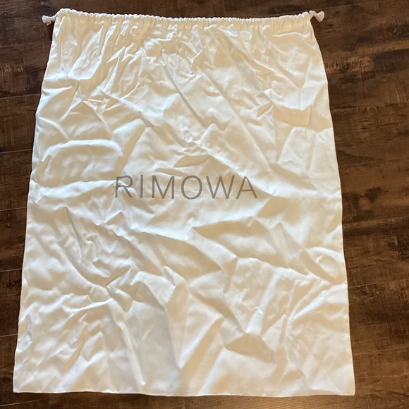 RIMOWA Handbags - RIMOWA White Travel Dust Bag New without tags. Never used.